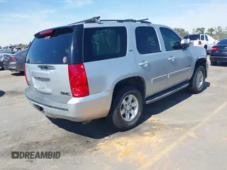 2014 GMC Yukon SLT with VIN 1GKS1CE04ER121301, listed as a IAAI auction lot 41825056 with 141,562 mi miles. Bid and sale history available at carsss.com. Image 4.