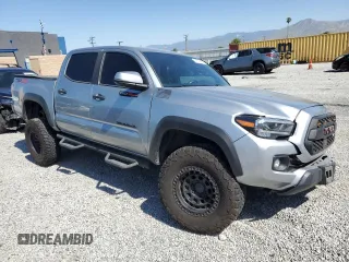 2023 Toyota Tacoma SR with VIN 3TMCZ5AN8PM545588, listed as a Copart auction lot 57528655 with 73,286 mi miles and Salvage title. Bid and sale history available at DreamBid. Image 4.