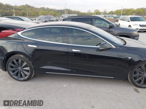 2017 Tesla Model S 100D with VIN 5YJSA1E28HF188981, listed as a IAAI auction lot 42010115 with 76,327 mi miles and . Bid and sale history available at DreamBid. Image 13.