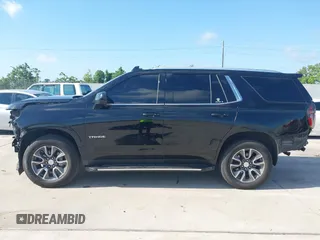 2023 Chevrolet Tahoe LT z VIN 1GNSCNKDXPR477061, wystawiony jako IAAI lot #42225743 z przebiegiem 57 077 mil mil oraz . Historia ofert i sprzedaży dostępna na DreamBid. Obrazek 14.