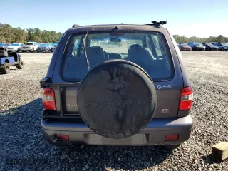 2000 Kia Sportage with VIN KNDJB7237Y5683960, listed as a Copart auction lot 75192944 with 127,615 mi miles and Salvage Title. Bid and sale history available at carsss.com. Image 6.