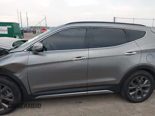 2018 Hyundai Santa Fe Ultimate with VIN 5NMZWDLAXJH100108, listed as a IAAI auction lot 42126768 with 68,325 mi miles and . Bid and sale history available at DreamBid. Image 14.