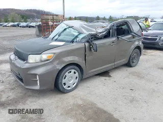 2014 Scion xB with VIN JTLZE4FE9EJ050596, listed as a IAAI auction lot 41884572 with 141,896 mi miles. Bid and sale history available at carsss.com. Image 2.