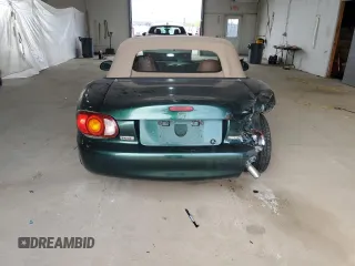 1999 Mazda MX-5 Miata z VIN JM1NB353XX0111850, wystawiony jako Copart lot #53076805 z przebiegiem 128 707 mil mil oraz Szkoda całkowita • Salvage title. Historia ofert i sprzedaży dostępna na DreamBid. Obrazek 6.