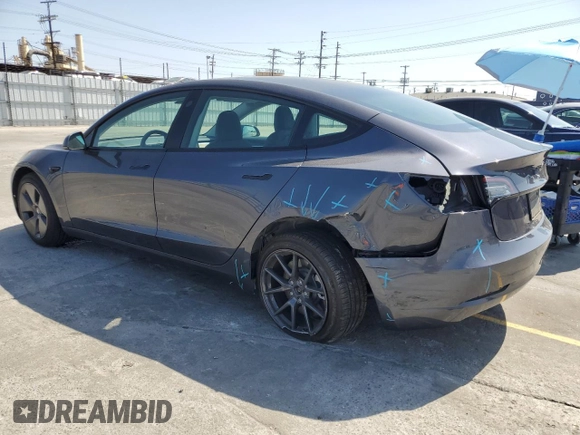 2023 Tesla Model 3 with VIN 5YJ3E1EA3PF695267, listed as a Copart auction lot 52559645 with 9,025 mi miles and Salvage title. Bid and sale history available at DreamBid. Image 2.