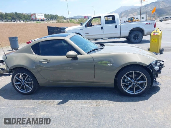 2023 Mazda MX-5 Miata Grand Touring z VIN JM1NDAM73P0561844, wystawiony jako IAAI lot #42195198 z przebiegiem 6 020 mil mil oraz . Historia ofert i sprzedaży dostępna na DreamBid. Obrazek 14.
