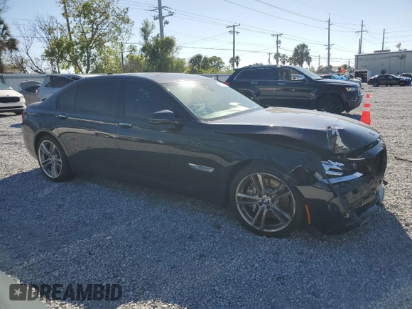 2015 BMW 7 Series 750Li with VIN WBAYE8C51FD781006, listed as a Copart auction lot 48202715 with 50,601 mi miles and Salvage Title. Bid and sale history available at carsss.com. Image 4.