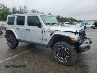 2023 Jeep Wrangler Rubicon with VIN 1C4JJXFM4PW589923, listed as a Copart auction lot 58725465 with 9,814 mi miles and Salvage title. Bid and sale history available at DreamBid. Image 4.