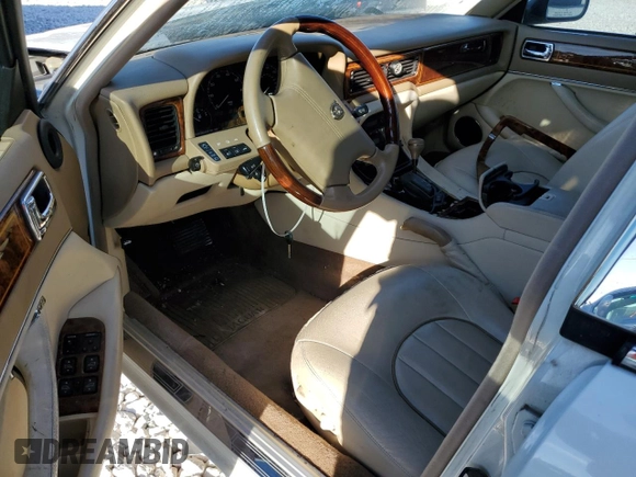 1995 Jaguar XJ with VIN SAJKX1745SC739290, listed as a Copart auction lot 82887524 with Not provided miles and Salvage title. Bid and sale history available at DreamBid. Image 8.