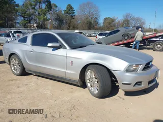 2012 Ford Mustang V6 Premium with VIN 1ZVBP8AM1C5224001, listed as a IAAI auction lot 41385559 with 165,123 mi miles. Bid and sale history available at carsss.com. Image 1.