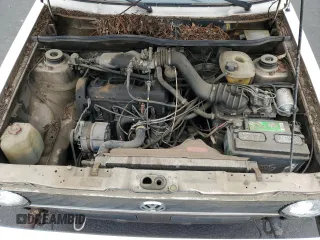 1984 Volkswagen Rabbit z VIN WVWCA0152EK015292, wystawiony jako Copart lot #55503315 z przebiegiem 216 970 mil mil oraz Tytuł czysty. Historia ofert i sprzedaży dostępna na DreamBid. Obrazek 11.