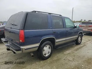 1999 GMC Yukon with VIN 1GKEK13R2XJ739931, listed as a Copart auction lot 74583734 with 115,605 mi miles and Salvage Title. Bid and sale history available at carsss.com. Image 3.