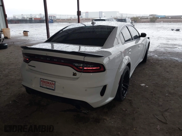 2023 Dodge Charger Scat Pack Widebody with VIN 2C3CDXGJ9PH516473, listed as a IAAI auction lot 41188167 with 38,021 mi miles and . Bid and sale history available at DreamBid. Image 4.