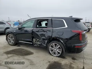 2023 Cadillac XT6 FWD Premium Luxury z VIN 1GYKPCRS5PZ119186, wystawiony jako Copart lot #50577175 z przebiegiem 32 189 mil mil oraz Szkoda całkowita • Salvage title. Historia ofert i sprzedaży dostępna na DreamBid. Obrazek 2.