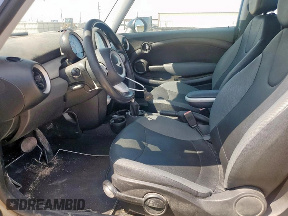 2010 MINI Hardtop with VIN WMWMF3C50ATZ61512, listed as a Copart auction lot 57819095 with 150,848 mi miles and Clean title. Bid and sale history available at DreamBid. Image 7.