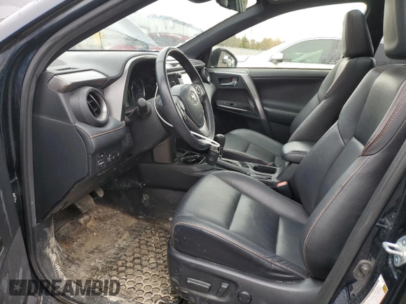 2018 Toyota RAV4 Hybrid SE with VIN JTMJJREV6JD225530, listed as a Copart auction lot 52000985 with 150,642 mi miles and Salvage title. Bid and sale history available at DreamBid. Image 7.