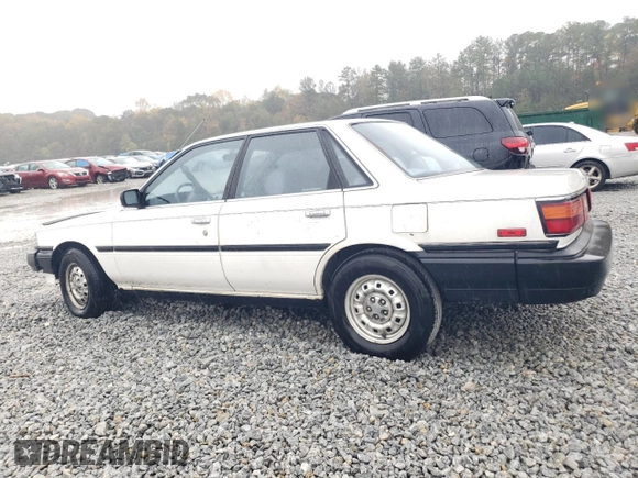 1988 Toyota Camry z VIN JT2SV21E7J3277138, wystawiony jako Copart lot #80039334 z przebiegiem 152 555 mil mil oraz Szkoda całkowita • Salvage title. Historia ofert i sprzedaży dostępna na DreamBid. Obrazek 2.