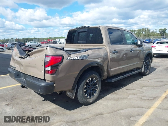 2021 Nissan Titan Pro-4X with VIN 1N6AA1ED4MN531369, listed as a IAAI auction lot 40597122 with 32,161 mi miles and . Bid and sale history available at DreamBid. Image 4.