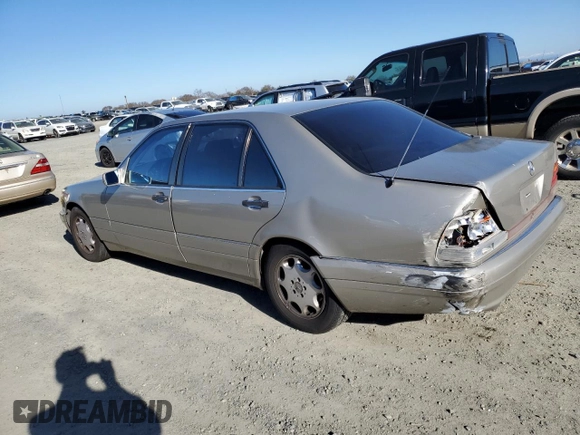 1996 Mercedes-Benz S with VIN WDBGA43E9TA311921, listed as a Copart auction lot 88758965 with 141,035 mi miles and Salvage Title. Bid and sale history available at DreamBid. Image 2.