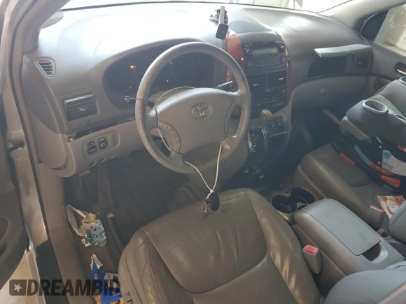 2010 Toyota Sienna XLE with VIN 5TDYK4CCXAS323450, listed as a Copart auction lot 62491545 with 220,121 mi miles and Salvage title. Bid and sale history available at DreamBid. Image 8.