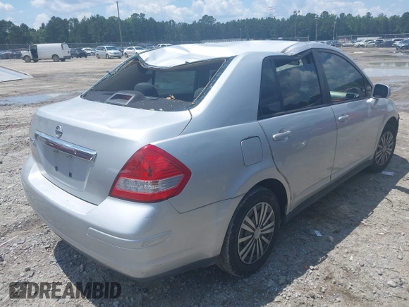 2011 Nissan Versa S with VIN 3N1BC1AP4BL446596, listed as a IAAI auction lot 42425302 with 141,047 mi miles and . Bid and sale history available at DreamBid. Image 4.