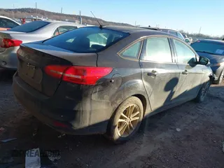 2017 Ford Focus SE with VIN 1FADP3F21HL288487, listed as a IAAI auction lot 41393074 with 87,883 mi miles. Bid and sale history available at carsss.com. Image 4.