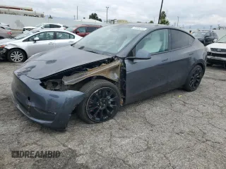 2023 Tesla Model Y Long Range z VIN 7SAYGDEE1PF899301, wystawiony jako Copart lot #72255244 z przebiegiem 9 559 mil mil oraz Szkoda całkowita • Salvage title. Historia ofert i sprzedaży dostępna na DreamBid. Obrazek 1.