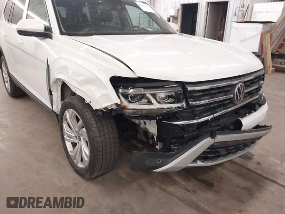 2021 Volkswagen Atlas SE z VIN 1V2HR2CA3MC539997, wystawiony jako IAAI lot #41977786 z przebiegiem 77 372 mil mil oraz . Historia ofert i sprzedaży dostępna na DreamBid. Obrazek 6.