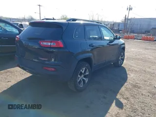 2014 Jeep Cherokee Trailhawk with VIN 1C4PJMBS5EW280598, listed as a IAAI auction lot 42079597 with 171,564 mi miles. Bid and sale history available at carsss.com. Image 4.