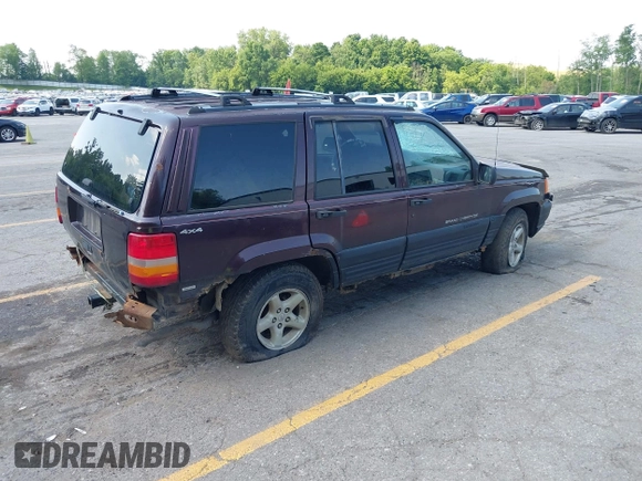 1997 Jeep Grand Cherokee Laredo with VIN 1J4GZ58S0VC708420, listed as a IAAI auction lot 42624603 with Not provided miles and . Bid and sale history available at DreamBid. Image 4.