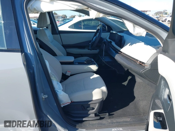 2024 Nissan ARIYA Evolve+ z VIN JN1BF0BA0RM435574, wystawiony jako IAAI lot #41657272 z przebiegiem 2 636 mil mil oraz . Historia ofert i sprzedaży dostępna na DreamBid. Obrazek 5.