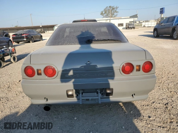 1992 Nissan Skyline z VIN HNR32035831, wystawiony jako Copart lot #74228974 z przebiegiem 49 082 mil mil oraz Szkoda całkowita • Salvage title. Historia ofert i sprzedaży dostępna na DreamBid. Obrazek 6.