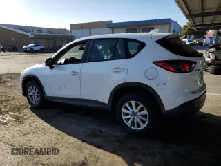2013 Mazda CX-5 Sport with VIN JM3KE2BE7D0148951, listed as a Copart auction lot 57782115 with 65,677 mi miles and Salvage title. Bid and sale history available at DreamBid. Image 2.