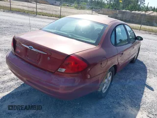 2003 Ford Taurus SES Standard with VIN 1FAFP55203G189473, listed as a IAAI auction lot 42013813 with 99,769 mi miles. Bid and sale history available at carsss.com. Image 4.