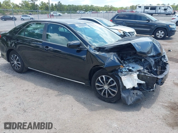 2014 Toyota Camry L with VIN 4T4BF1FKXER402857, listed as a IAAI auction lot 42144757 with 192,081 mi miles and . Bid and sale history available at DreamBid. Image 1.