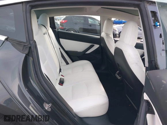 2018 Tesla Model 3 Long Range Battery with VIN 5YJ3E1EB9JF097118, listed as a IAAI auction lot 41619510 with 64,132 mi miles and . Bid and sale history available at DreamBid. Image 8.
