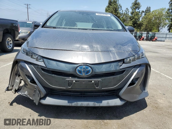 2021 Toyota Prius LE z VIN JTDKAMFPXM3174518, wystawiony jako Copart lot #58854495 z przebiegiem 83 445 mil mil oraz Szkoda całkowita • Salvage title. Historia ofert i sprzedaży dostępna na DreamBid. Obrazek 5.