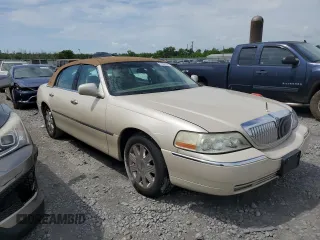 2003 Lincoln Town Car Cartier z VIN 1LNHM83W33Y690270, wystawiony jako Copart lot #51682235 z przebiegiem 118 355 mil mil oraz Szkoda całkowita • Salvage title. Historia ofert i sprzedaży dostępna na DreamBid. Obrazek 4.