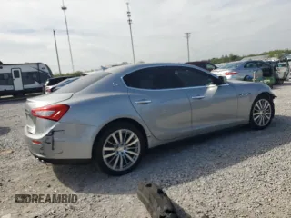 2014 Maserati Ghibli z VIN ZAM57XSA8E1087661, wystawiony jako Copart lot #54215595 z przebiegiem 108 280 mil mil oraz Szkoda całkowita • Salvage title. Historia ofert i sprzedaży dostępna na DreamBid. Obrazek 3.