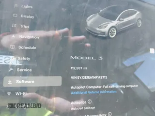 2022 Tesla Model 3 with VIN 5YJ3E1EA1NF142713, listed as a IAAI auction lot 42027630 with 112,557 mi miles. Bid and sale history available at carsss.com. Image 14.