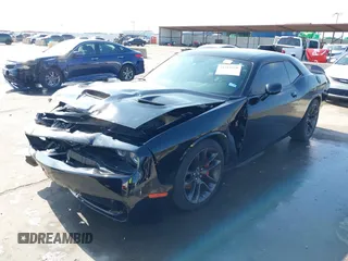 2021 Dodge Challenger R/T Scat Pack z VIN 2C3CDZFJXMH509833, wystawiony jako IAAI lot #41516858 z przebiegiem 66 880 mil mil oraz . Historia ofert i sprzedaży dostępna na DreamBid. Obrazek 18.