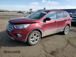 2018 Ford Escape SE z VIN 1FMCU9GD0JUC29279, wystawiony jako Copart lot #54511595 z przebiegiem 77 547 mil mil oraz Tytuł czysty. Historia ofert i sprzedaży dostępna na DreamBid. Obrazek 1.