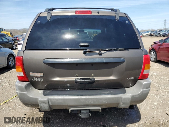 2000 Jeep Grand Cherokee Laredo z VIN 1J4GW48N9YC239166, wystawiony jako Copart lot #53321135 z przebiegiem 142 162 mil mil oraz Szkoda całkowita • Salvage title. Historia ofert i sprzedaży dostępna na DreamBid. Obrazek 6.