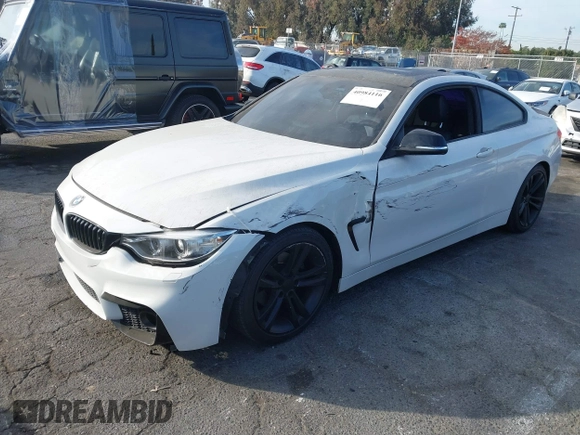 2014 BMW 4 Series 428i with VIN WBA3N3C5XEF710869, listed as a IAAI auction lot 40984116 with 115,958 mi miles and . Bid and sale history available at DreamBid. Image 2.