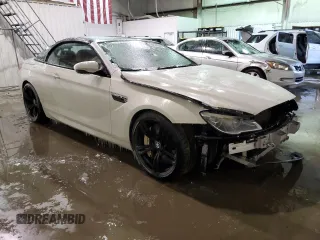 2016 BMW M6 z VIN WBS6G9C58GD932069, wystawiony jako Copart lot #55722063 z przebiegiem 61 793 mil mil oraz . Historia ofert i sprzedaży dostępna na DreamBid. Obrazek 4.