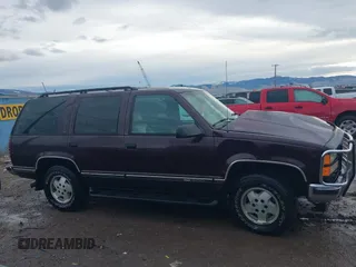 1997 GMC Yukon with VIN 1GKEK13R0VJ755574, listed as a IAAI auction lot 41158932 with 212,668 mi miles. Bid and sale history available at carsss.com. Image 14.