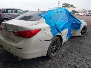 2014 Infiniti Q50 Premium with VIN JN1BV7AP4EM691857, listed as a IAAI auction lot 42372219 with 177,021 mi miles and . Bid and sale history available at DreamBid. Image 4.