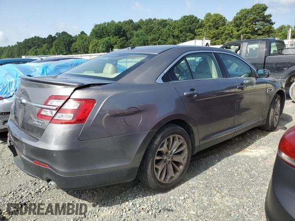 2014 Ford Taurus Limited with VIN 1FAHP2F84EG149622, listed as a Copart auction lot 63764675 with 208,801 mi miles and Salvage title. Bid and sale history available at DreamBid. Image 3.