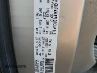 2013 Dodge Grand Caravan Crew with VIN 2C4RDGDG4DR567707, listed as a Copart auction lot 52731005 with 210,359 mi miles and Salvage Title. Bid and sale history available at DreamBid. Image 13.