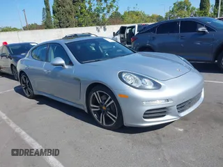 2016 Porsche Panamera 4 with VIN WP0AA2A72GL001734, listed as a IAAI auction lot 42666289 with 92,656 mi miles and . Bid and sale history available at DreamBid. Image 1.